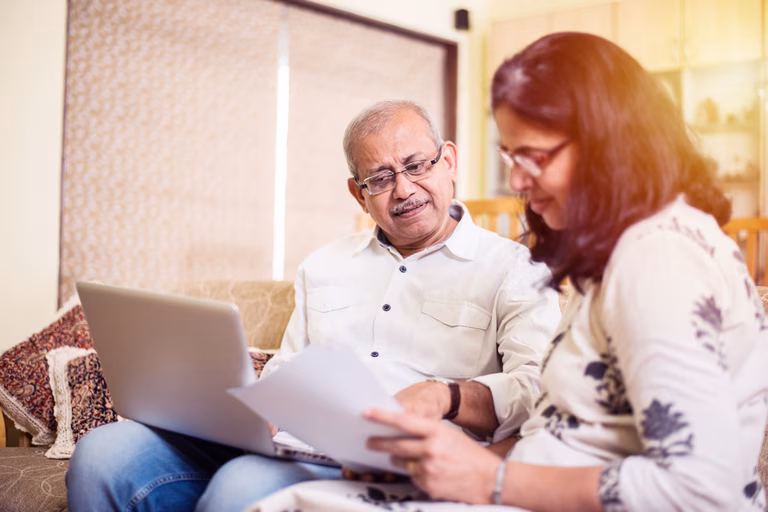 Senior couple looking over documents