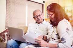 Image of a husband and wife reviewing a family agreement