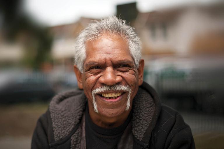 Image of an Aboriginal man with a grey moustache and hair