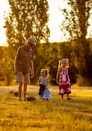 Grandfather taking his grandkids on a walk 