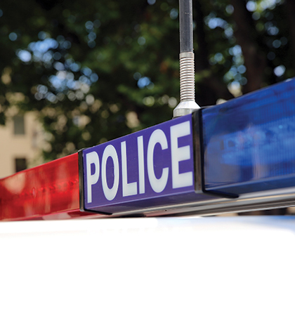 Photo of police lights on top of a police car