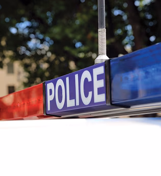 Photo of police lights on top of a police car