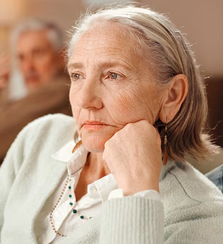 Photo of a woman resting her chin on her hand