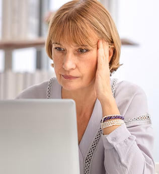 Photo of a woman working on her laptop