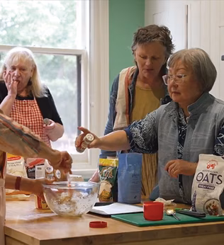 Photo of women in a kitchen baking together