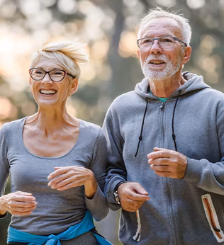 Photo of couple in grey sweats jogging