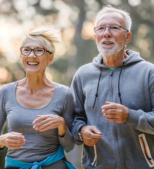 Photo of couple in grey sweats jogging
