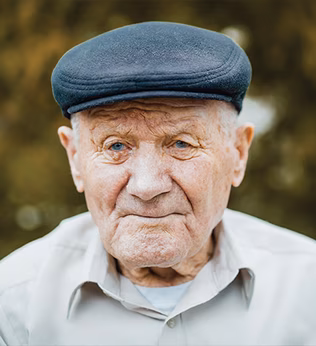 Photo of a senior gent in a cloth cap