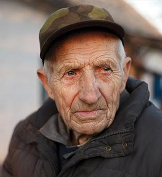 Photo of man wearing camo cap and charcoal jacket