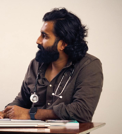 A doctor sitting at a desk