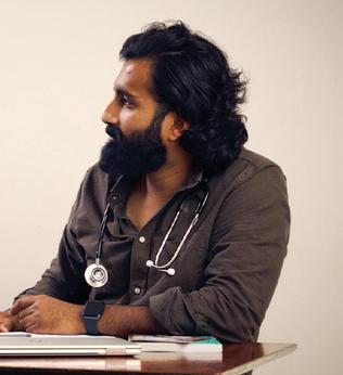 A doctor sitting at a desk