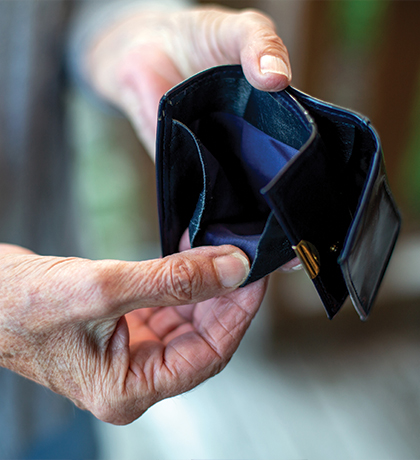 Photo of hands holding open an empty wallet