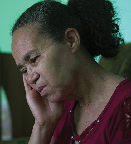Photo of a woman resting her head in her hand