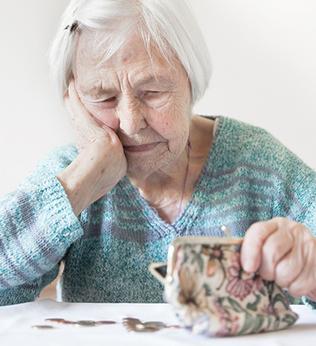 Photo of a woman looking into her purse
