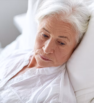 Photo of a woman with white hair and a white shirt