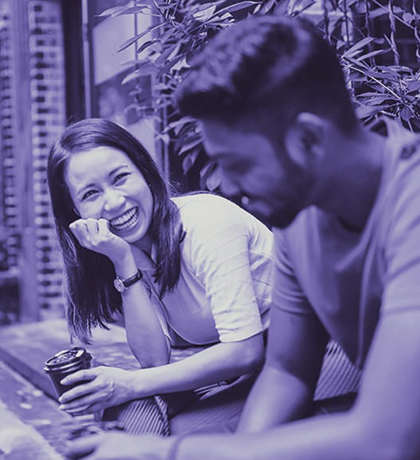 Photo of two people laughing together