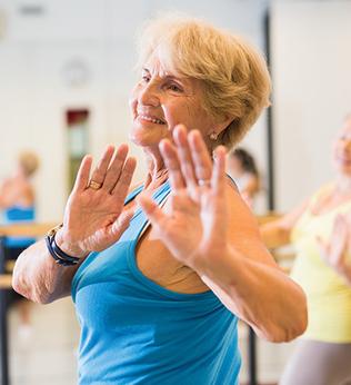Photo of women in a dance class wearing gym clothes
