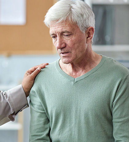 Photo of woman comforting man
