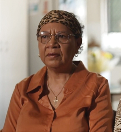 Photo of two women wearing earth tone blouses