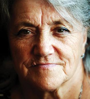 Photo of woman on a moody black background