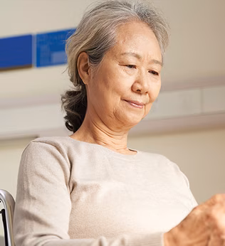 Photo of a woman sitting in a wheelchair