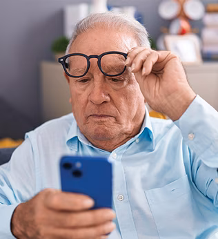 Photo of man looking at his phone