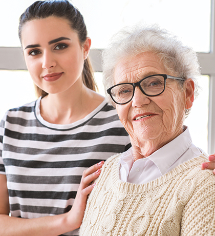 Photo of a young woman and an elderly woman
