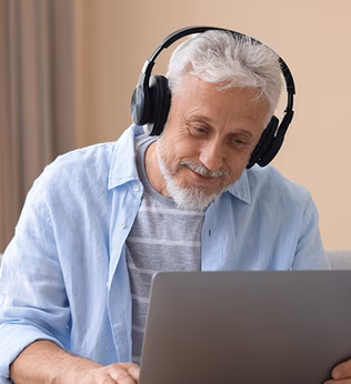 Photo of a smiling man wearing headphones