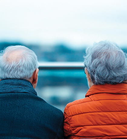 Photo of two people wearing warm jackets