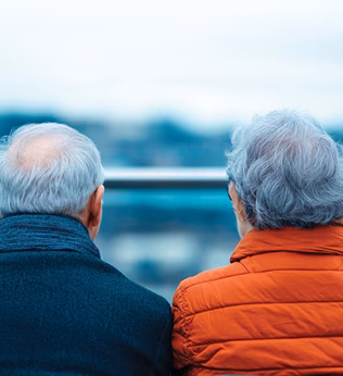 Photo of two people wearing warm jackets