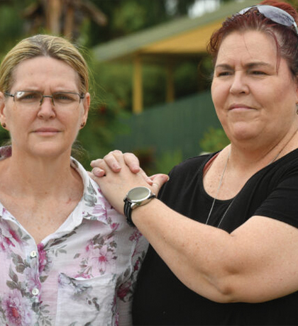 Photo of two women standing together outdoors