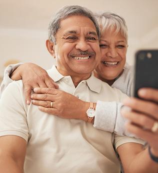 Photo of two people taking a selfie