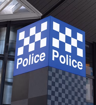 Photo of blue and white chequered police sign