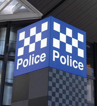 Photo of blue and white chequered police sign