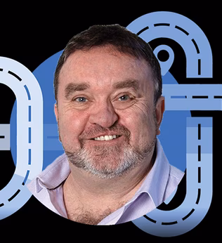 Photo of a smiling man with a beard