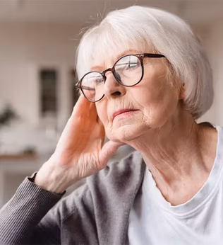 Photo of woman with glasses looking pensive