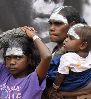 Photo of indigenous child, woman, and baby