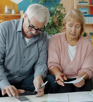 Photo of a man and a woman going through paperwork together