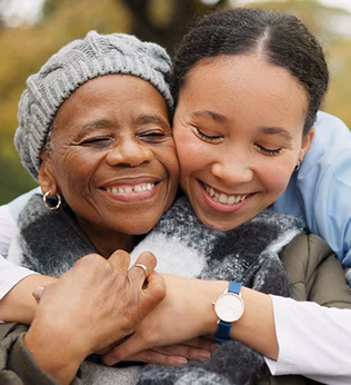 Photo of a woman embracing the shoulders of another woman