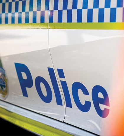 Photo of a closeup of the side of a police car