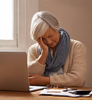 Photo of woman in front of her laptop