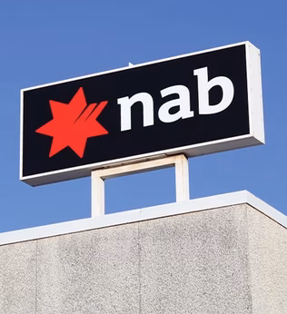 Photo of NAB sign on top of building