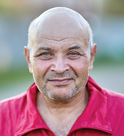 Photo of a man wearing a red shirt