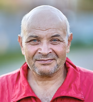 Photo of a man wearing a red shirt