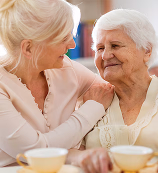 Photo of two women enjoying a tea break together