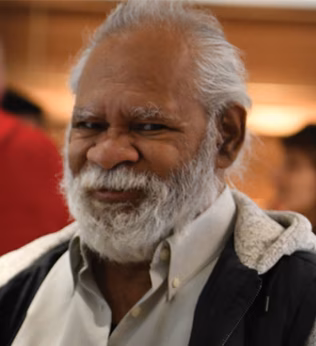 Photo of a smiling man at a gathering