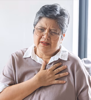 Photo of a woman in glasses looking troubled