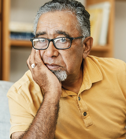Photo of a man in a yellow polo shirt