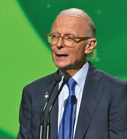 Photo of Dr Brodaty speaking in front of a green screen