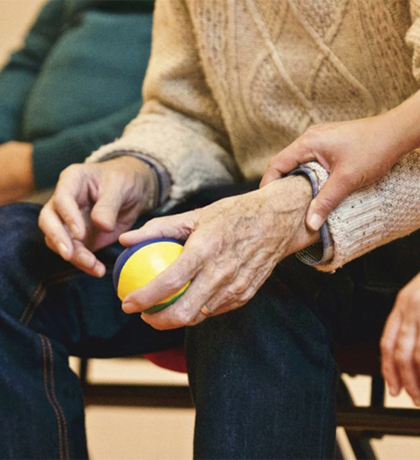 Photo of a hold and young hands and laps